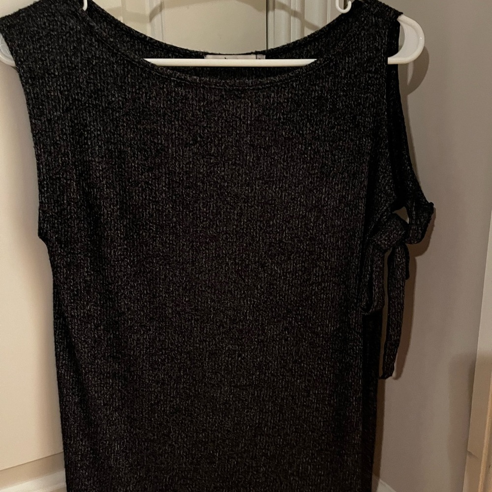 Red haute shirt. Size S. Cold shoulder tie detail on one side. New without tags